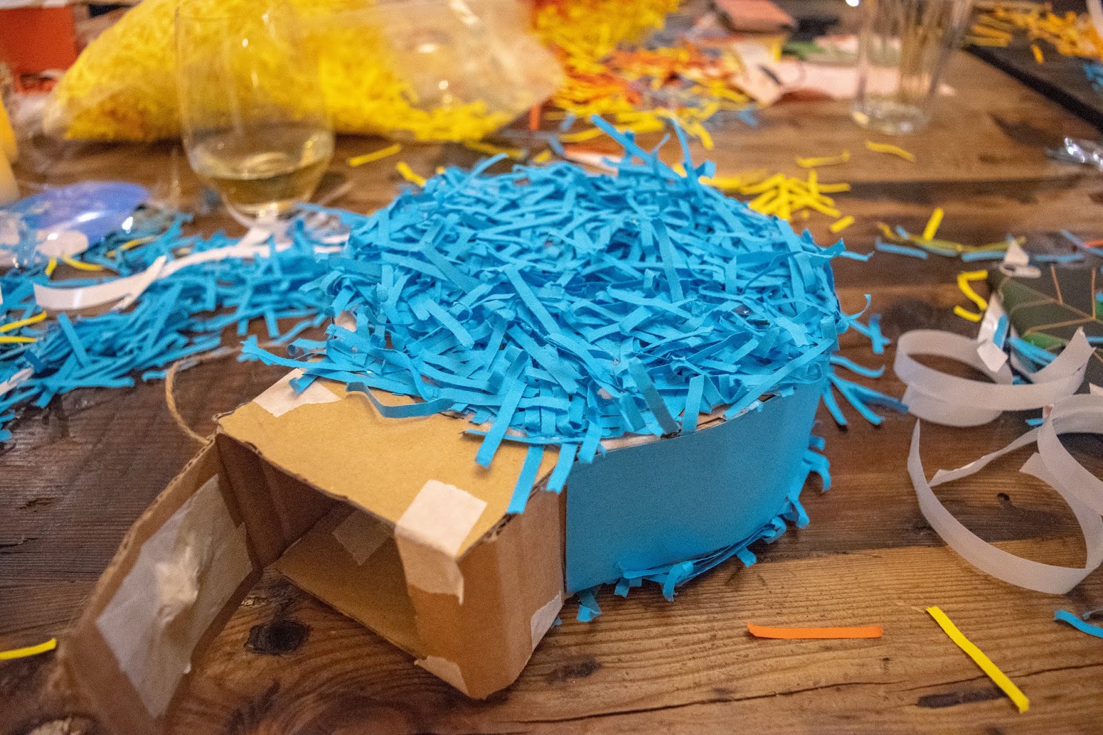 My bauble shaped pinata covered in blue shredded paper.