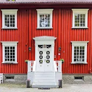 White door in Bakklandet in Trondheim Norway