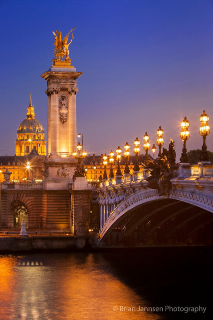 The Pont Alexandre III with the L'Hôtel national des Invalides or Les Invalides in the background.