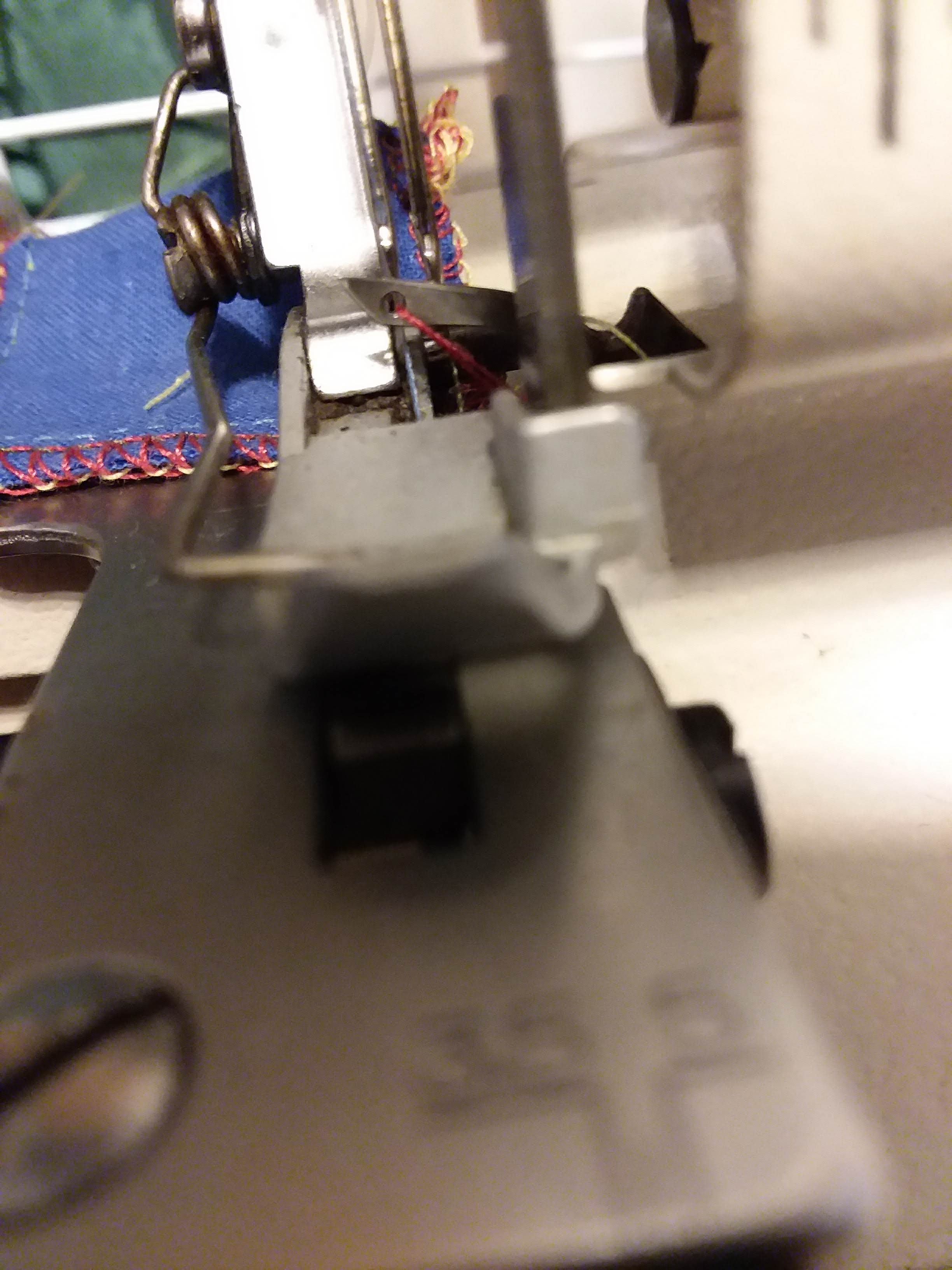 Serger won't catch upper looper thread in left needle