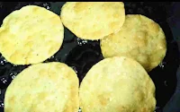 Deep frying four pakwan till crisp golden for dal pakwan recipe