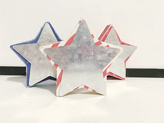 galvanized stars on wooden stars