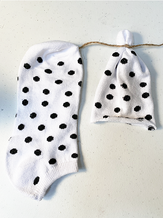 2 polka dotted socks, one cut