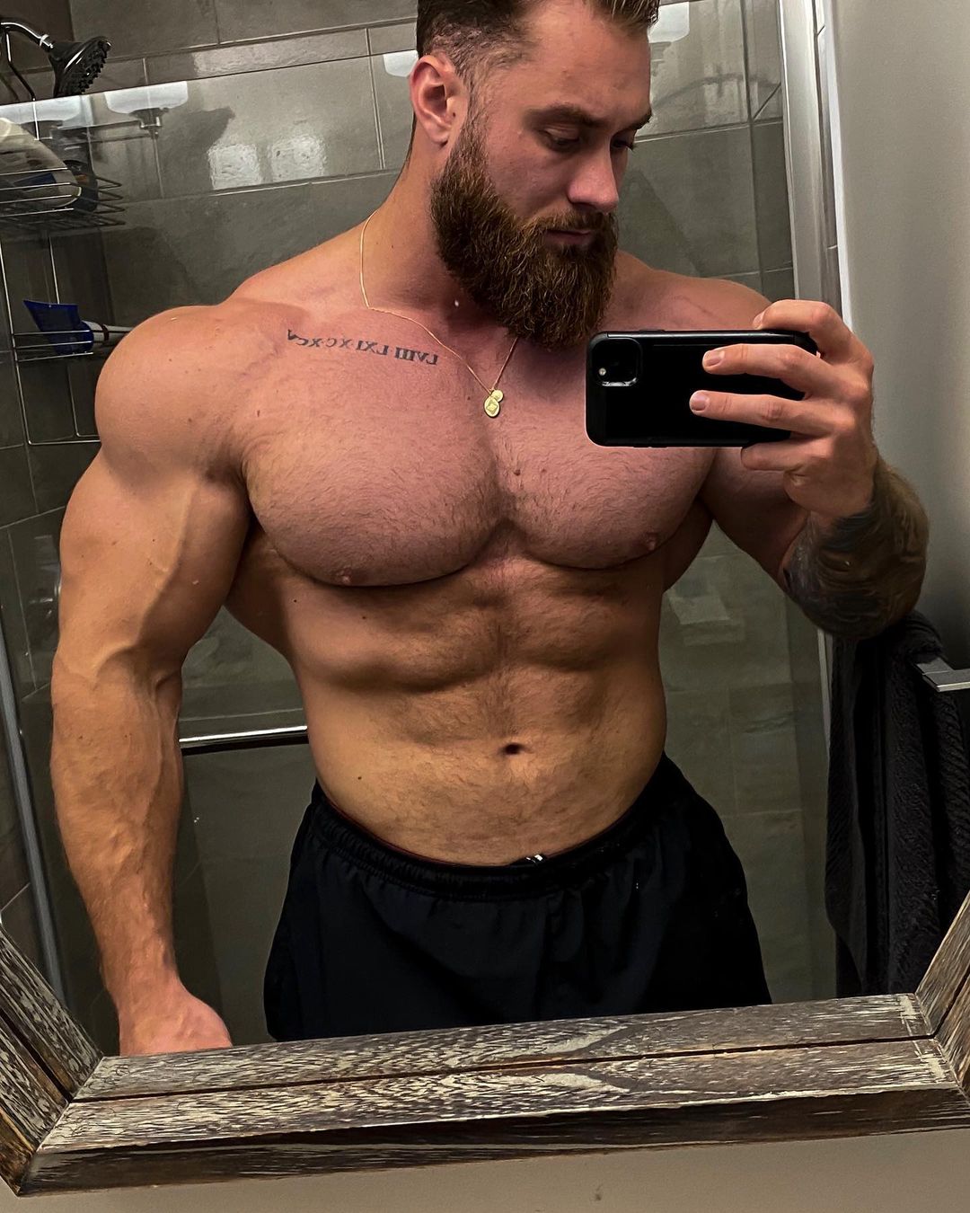 huge-strong-shirtless-bodybuilder-daddy-chris-bumstead-wide-shoulders-selfie