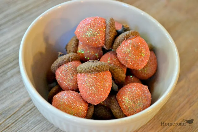 glittered acorns in a bowl