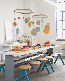 this DIYer used embroidery hoops to make gorgeous hanging mobiles in her kitchen