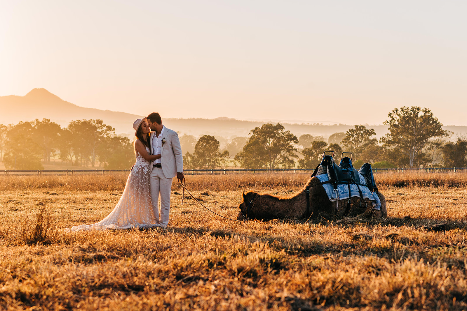 to the aisle australia | champagne at sunrise summer land camels shoot match made photography gold coast weddings country boho floral design cake stationery venue