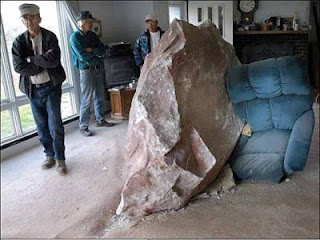 rock crashes into living room
