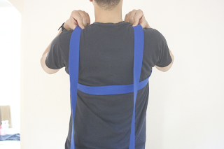 2. Place straps ends over the shoulders.