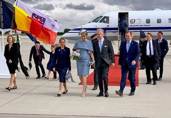 Queen Mathilde wore Natan grey cape dress. Thuringia and Saxony-Anhalt states of Germany. Erfurt-Weimar airport