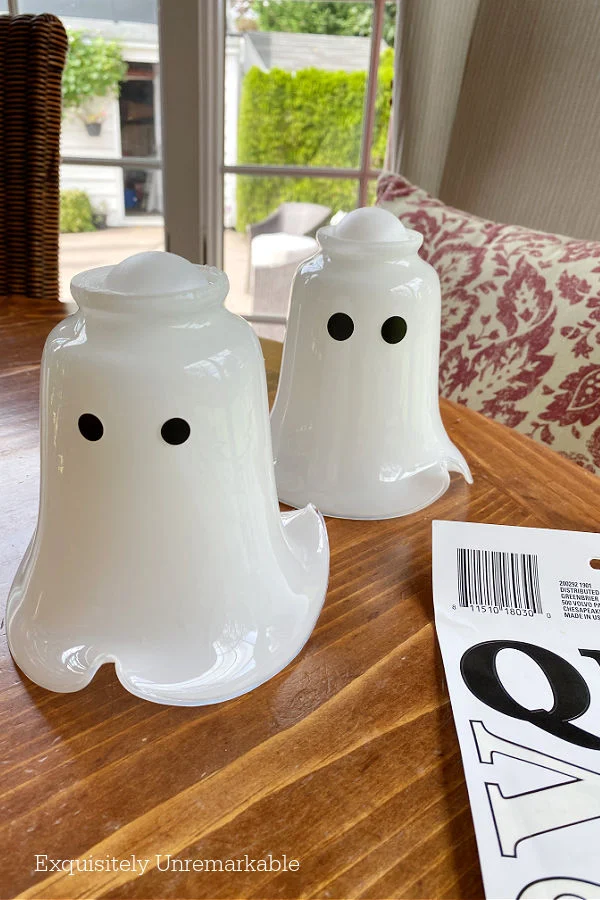 DIY Upcycled Ghost Lanterns on a table