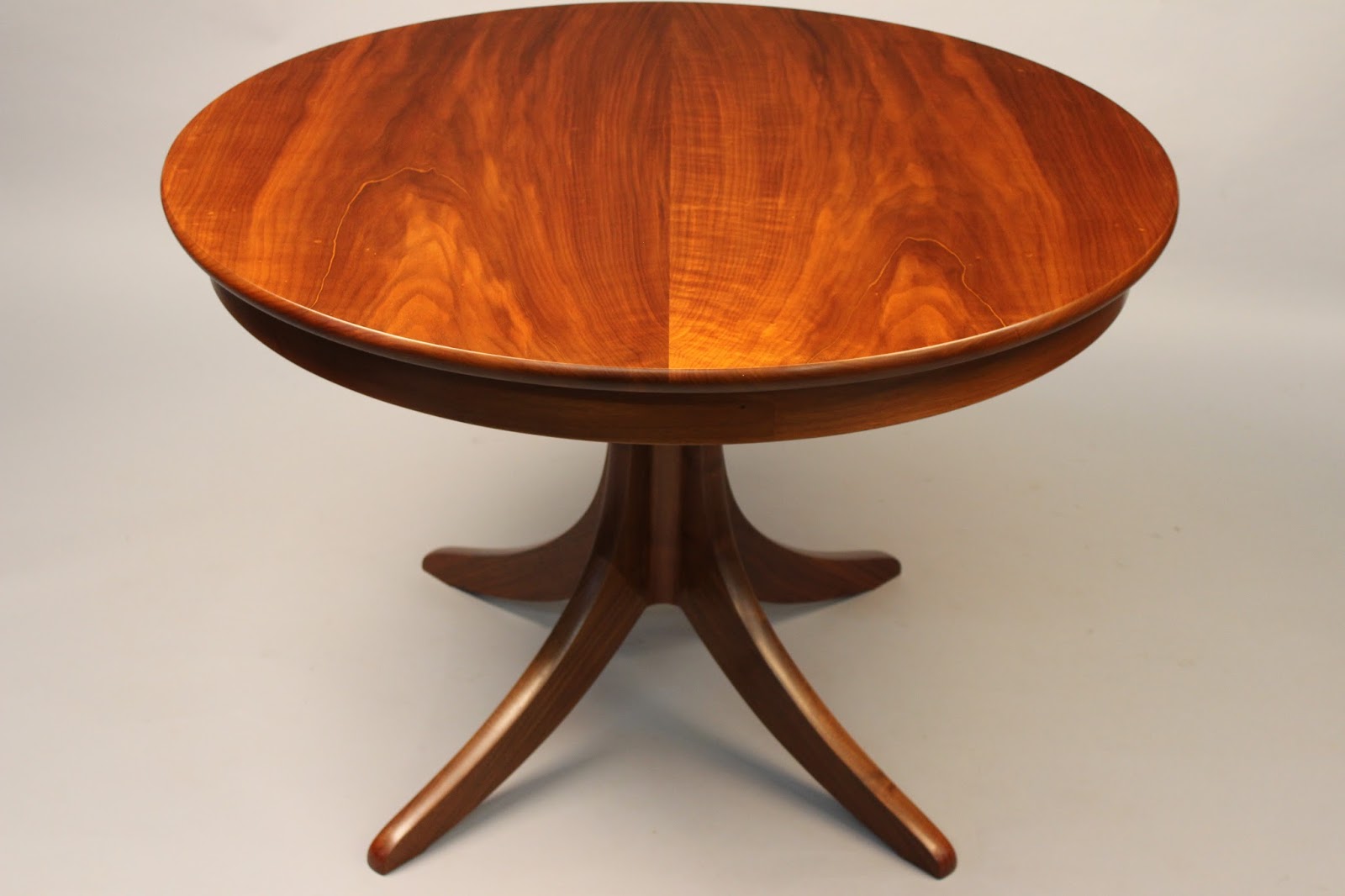 Pedestal table handcrafted of walnut