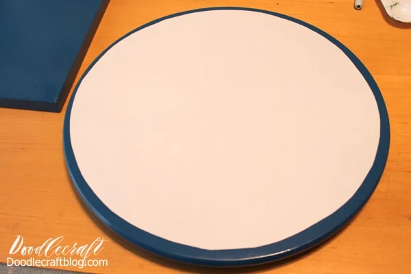 Then cut out the circle and cut an additional half inch or so from the edge. Then peel off the paper backing and place the vinyl on the top of the Lazy Susan.
