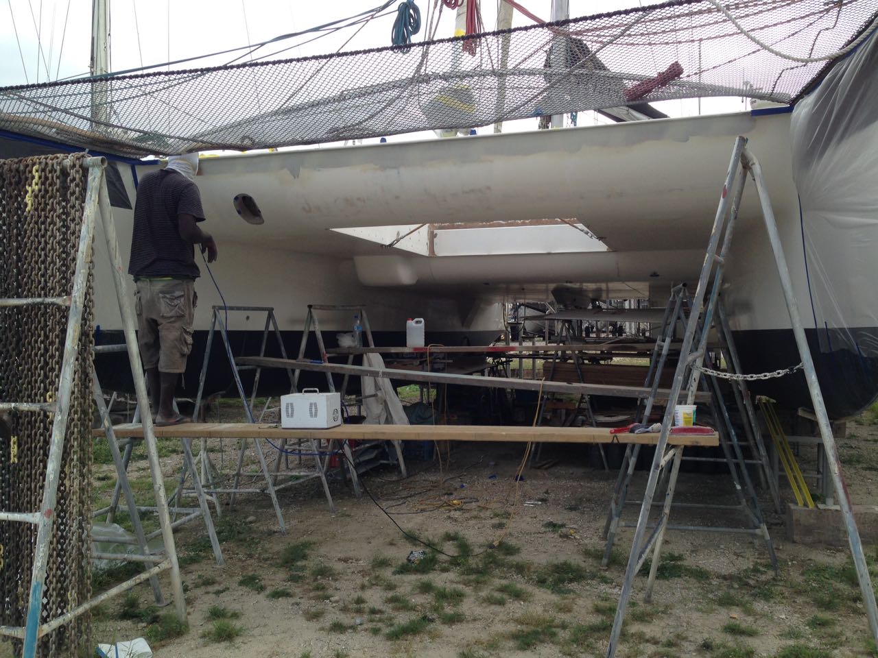 S/Y RAPTOR Spray Painting Our Deck