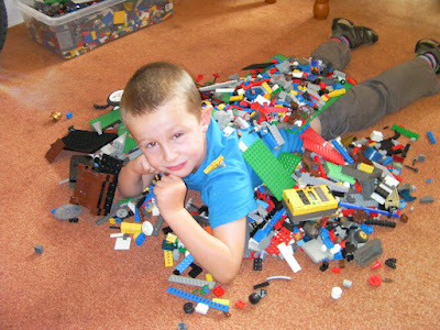 boy with lego collection