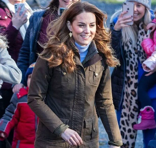 Kate Middleton wore a gray knit turtleneck, black skinny jeans, a khaki Barbour jacket, and knee-high Penelope Chilver boots