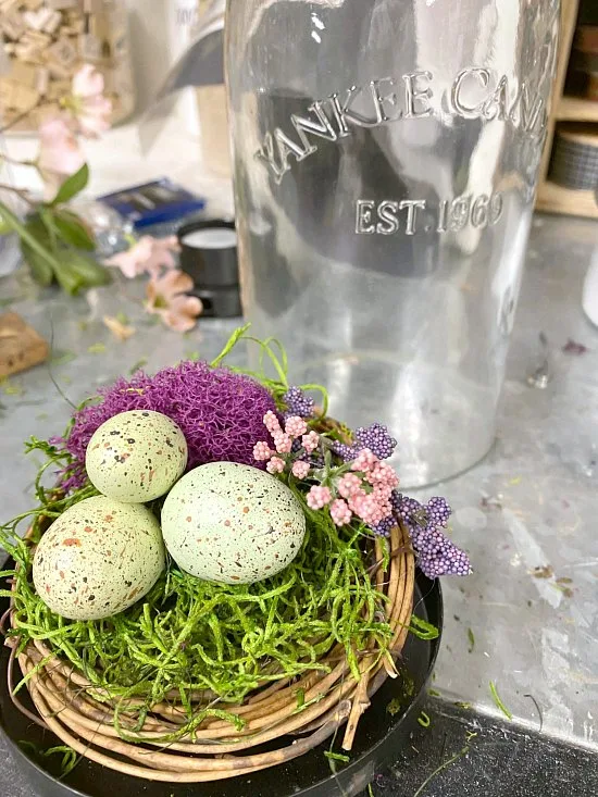 nest with eggs and glass lantern