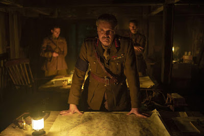 Movie still for "1917" showing Colin Firth as General Erinmore giving two British Lance Corporals a dangerous mission into occupied territory.