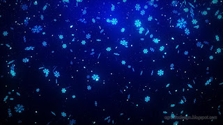 Blue Light Shining Snowflakes Falling Blowing In Wind Of Christmas Holiday Background Concept