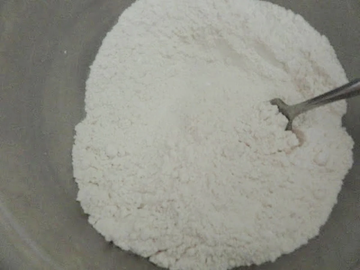 Flour, Baking Soda, Baking Powder, and Salt mixed together in a medium sized bowl.