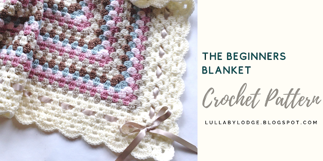 A pretty granny square baby blanket with shell edging