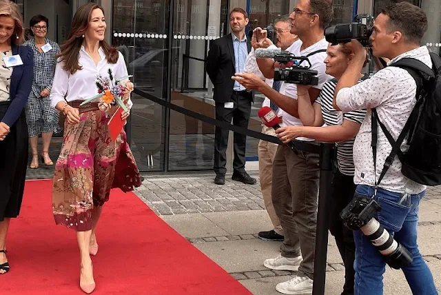 Crown Princess Mary wore a pleated printed silk crepe-de-chine midi skirt and white silk shirt from Valentino