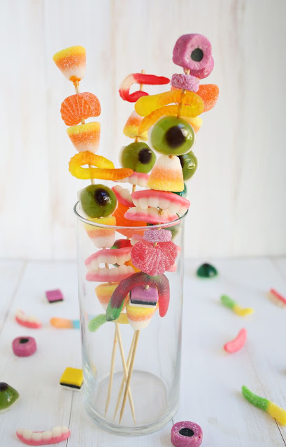 Monster cocktail stirrer for Halloween Halloween Monster cocktail stirrers for adults. Creepy crawly gummy candy for cocktail stirrer. Halloween creepy treats ideas for adults. Halloween food and drinks ideas for party. Halloween party food ideas. Halloween trick and treat ideas. Halloween foods ideas for party. Easy Halloween food ideas for adults.