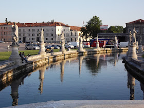 Statues line the canal in the elliptical Prato della Valle
