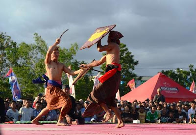 Peresean is a unsafe sport that has choke a  BaliTourismMap: Fights Cane Culture inward Lombok