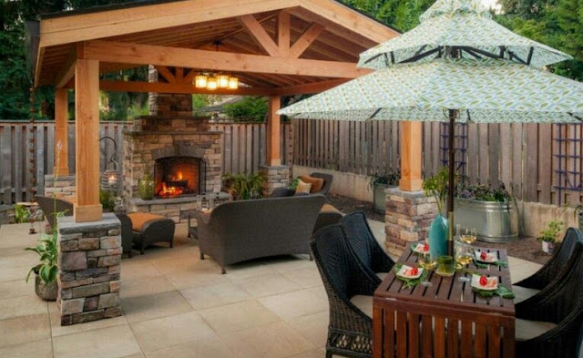 covered outdoor living spaces with fireplace