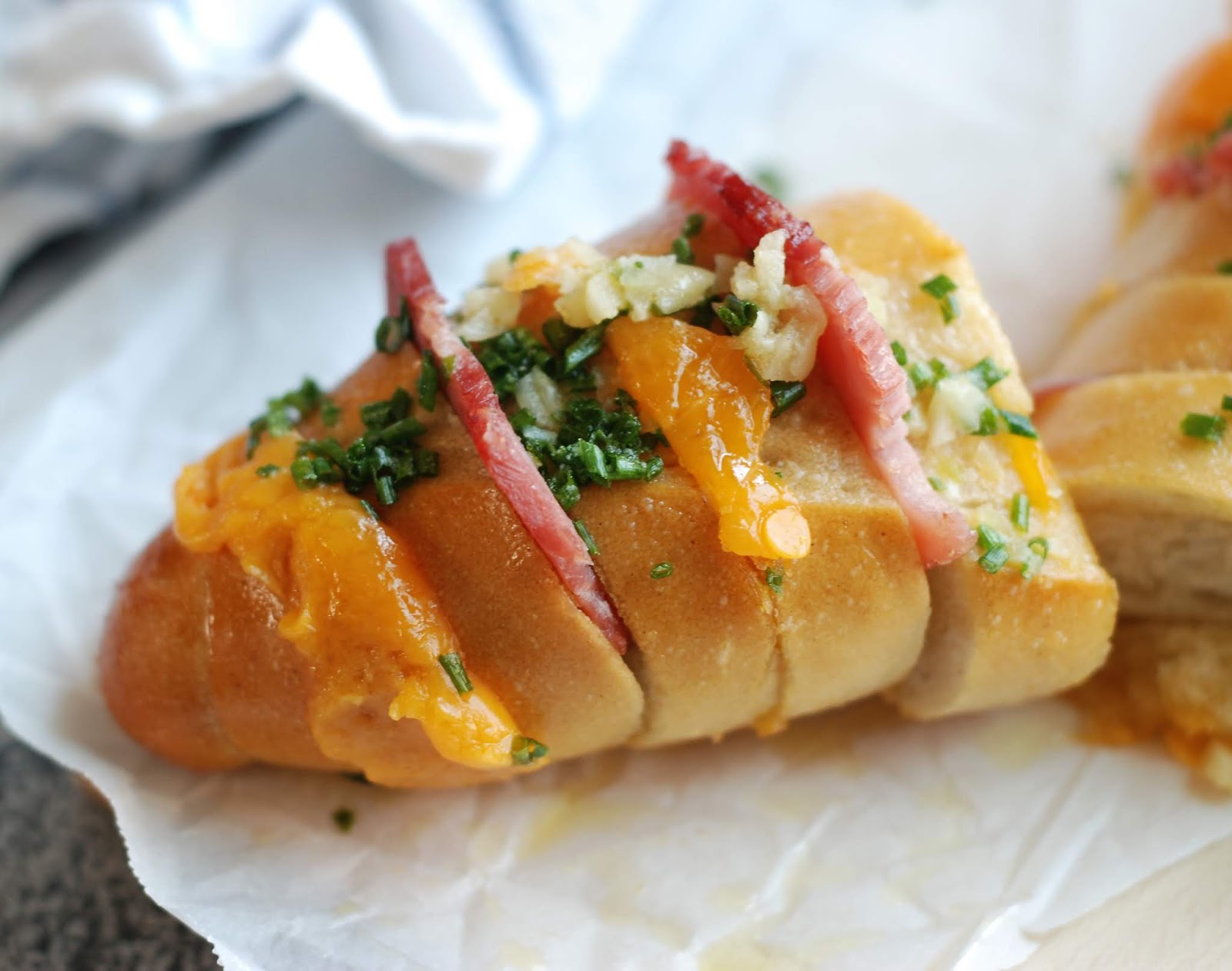 Fleur DeLectable Hasselback Ham and Cheese Garlic Bread