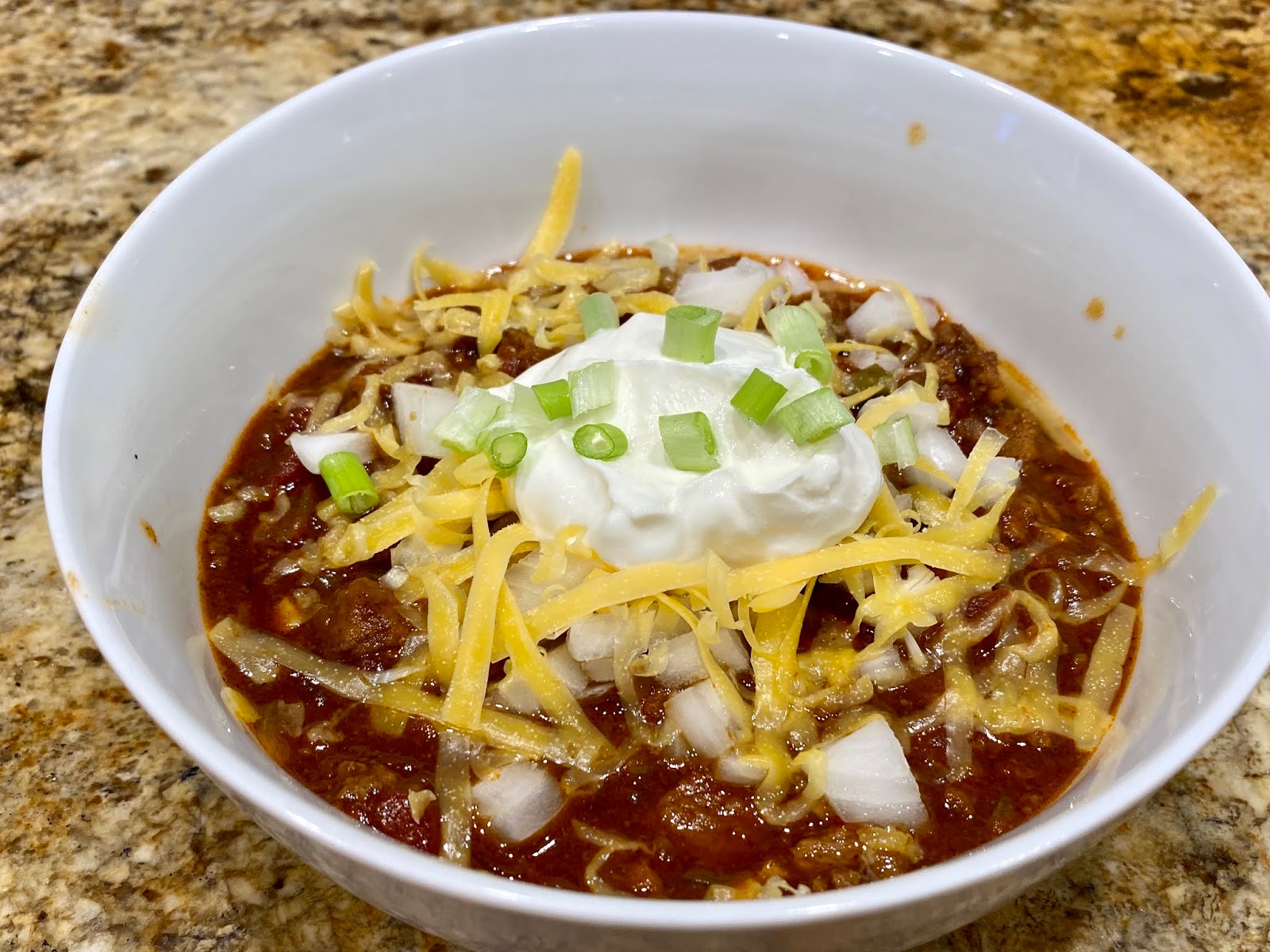 GREAT EATS HAWAII CHILI WITH BEEF, CHEESE, ONIONS AND SOUR CREAM