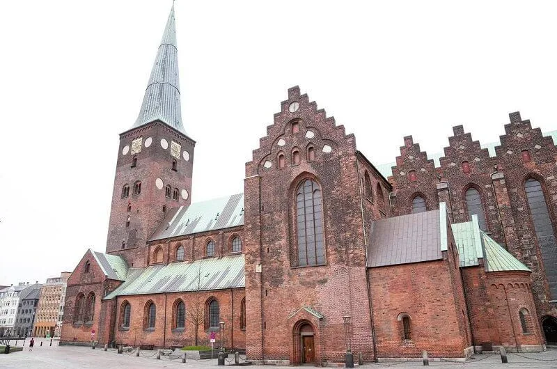 Brown fur coat. Aarhus Cathedral Choir that performed Easter hymns. Crown Princess Mary, Princess Isabella and Princess Marie