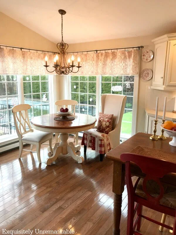 Red and white cottage kitchen nook without a rug on the floor