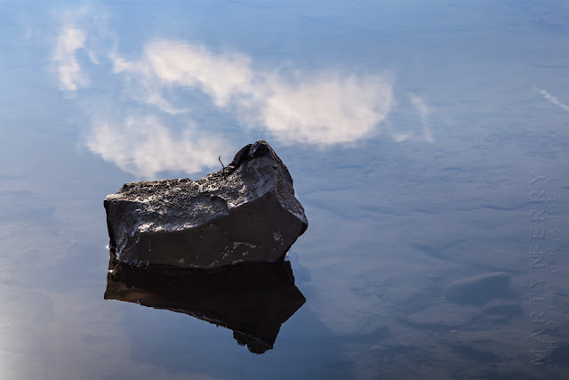 Robin Hood's Bay reflection of a rock and clouds by Martyn Ferry Photography