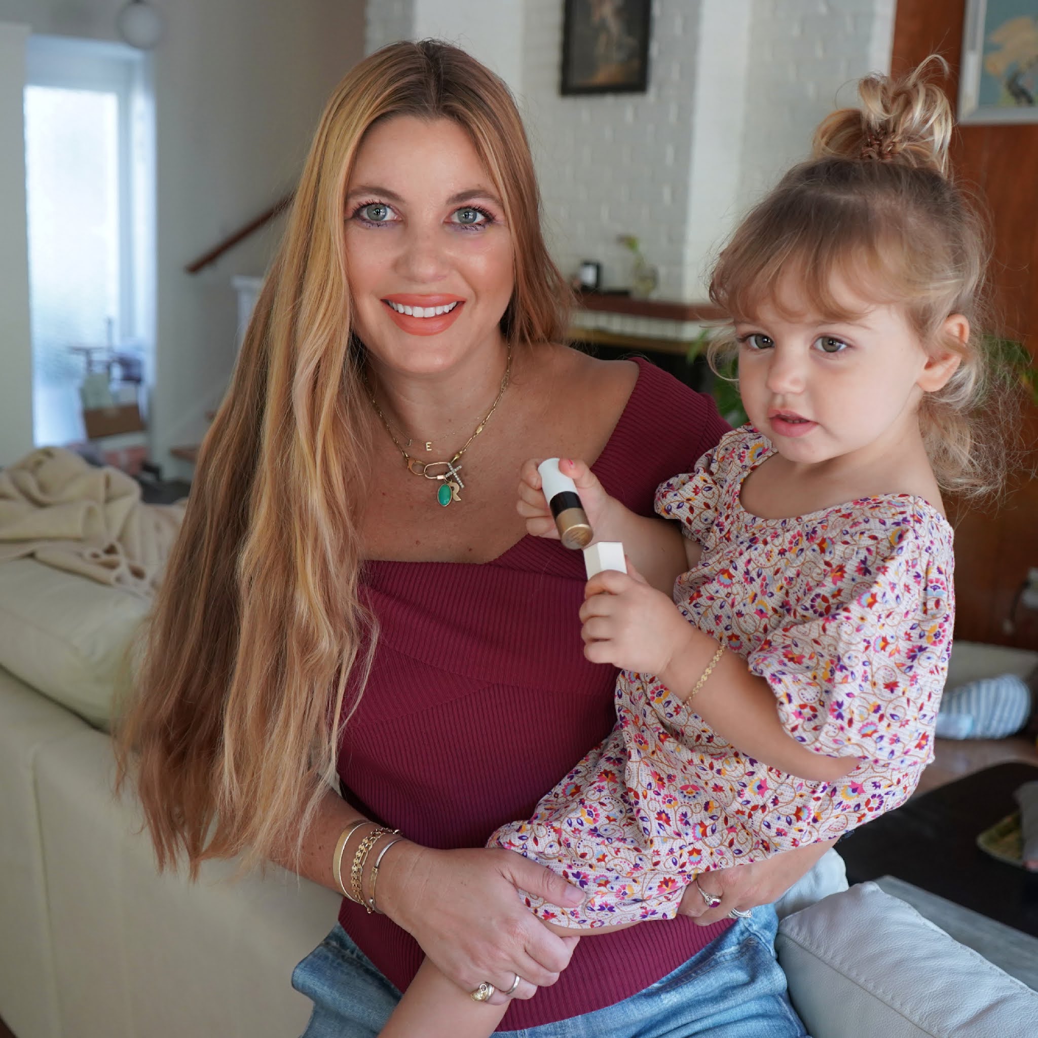 woman with her kid holding products from Beauty from Nordstrom