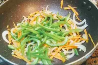 Sauteeing carrot, capsicum, onion and cabbage for hakka noodles veg recipe