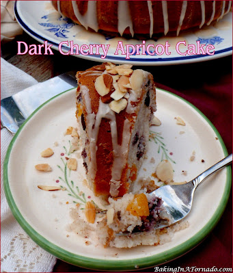 Dark Cherry Apricot Cake, perfect for the holidays, this cake features sweet dark cherries, apricots, blackberry jam, and dark chocolate chips. | recipe developed by www.BakingInATornado.com | #recipe #dessert