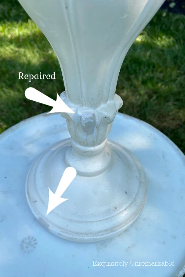 Arrows pointing to areas that were fixed on a Repaired Plaster Lamp