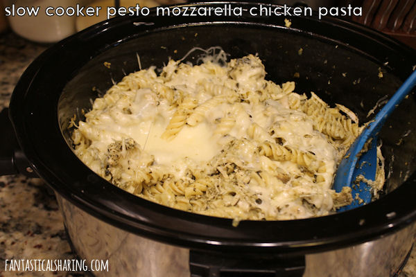 Slow Cooker Pesto Mozzarella Chicken Pasta // This crockpot meal is buttery, cheesy, and full of pesto goodness! #recipe #pesto #chicken #pasta #crockpot #SundaySupper