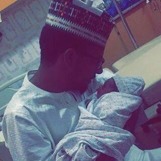 c Photos: Emir of Kano cradles his new grandchild