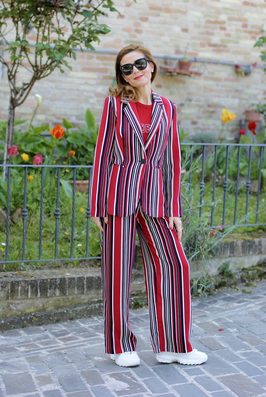 Suit up! A striped suit worn with sneakers on Fashion and Cookies fashion blog, fashion blogger style
