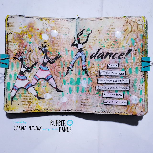 An art journal spread with the Happy Dancing stamp by Saadia