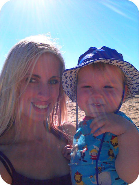 parent and child at the beach, enjoying the sunshine