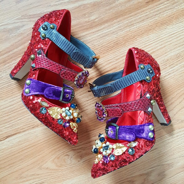 red sequins shoes with embellishment on wooden floor