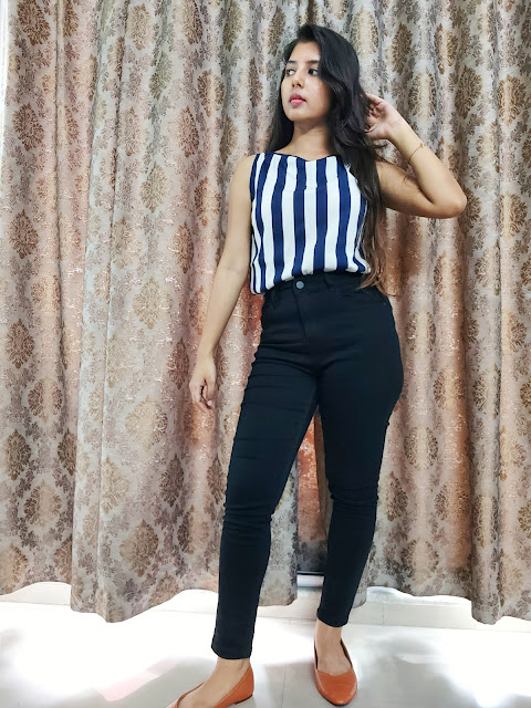 Ritu Biswas wearing high waist black jeans and top for a taller look in her fashion and lifestyle blog. Ritu Biswas wearing high waist black jeans and top for a taller look in her fashion and lifestyle blog.