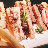 Serving veg club sandwich with fries and coleslaw for veg club sandwich recipe