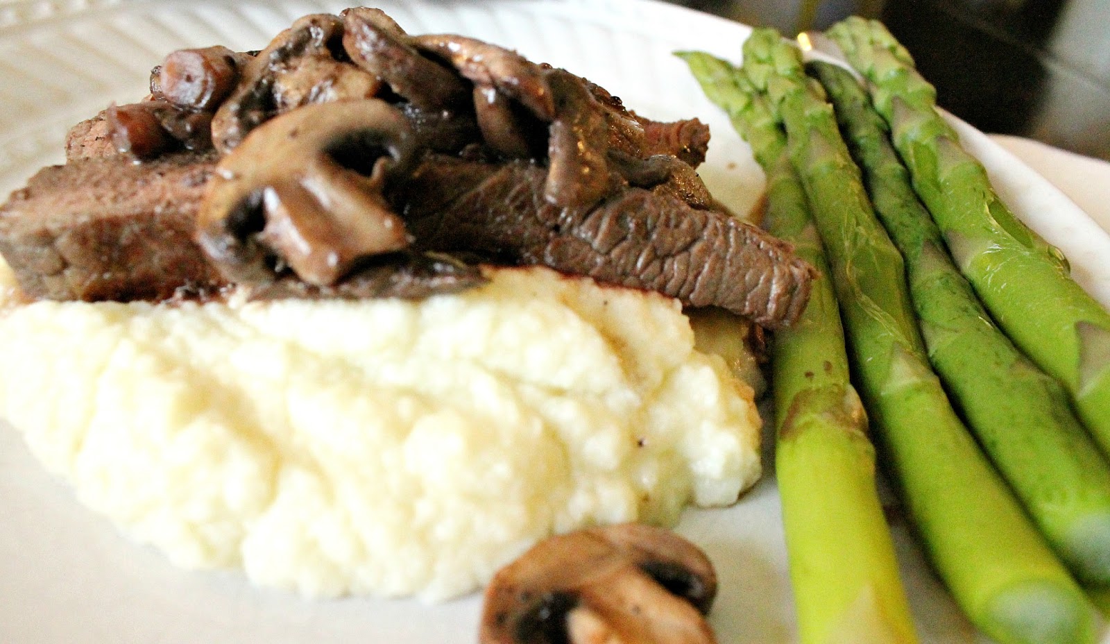Steak with Mushroom Sauce, Cauliflower Puree, and Asparagus