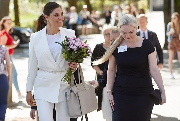 Crown Princess Victoria wore H&M Jacket with Tie Belt and H&M trousers at Tobias Registry's anniversary ceremony at Lund University Stockholm