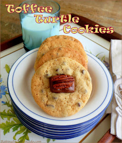 Toffee Turtle Cookies are a cookie reminiscent of a well known candy treat. Pecan and mini chocolate chip cookies are topped with a miniature toffee and pecan half. | Recipe developed by www.BakingInATornado.com | #recipe #chocolate